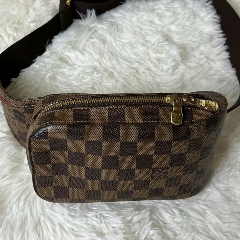 Like new Louis Vuitton  Damier Ebene Geronimo has C O A certified and box